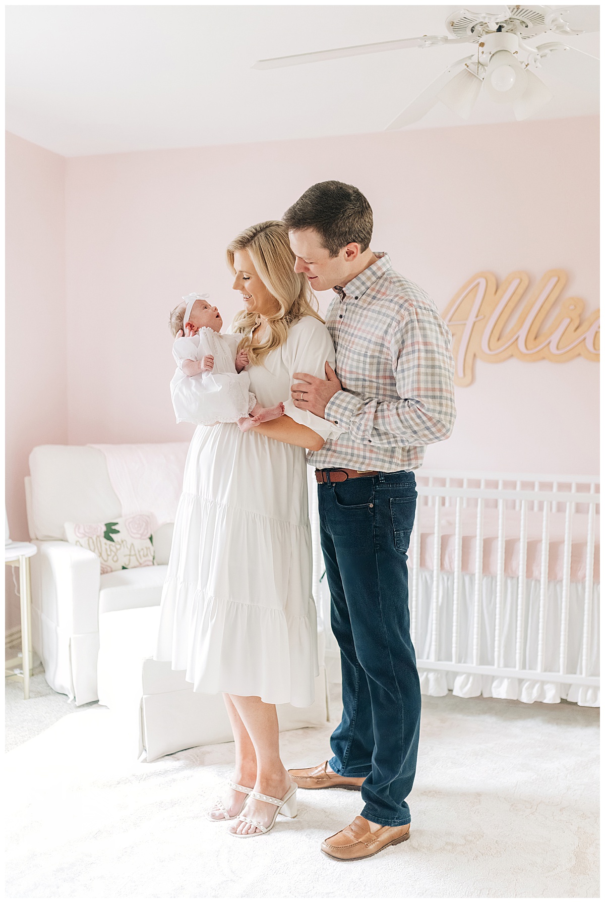 Photo of mom dad and newborn baby in nursery taken by northwest Arkansas photographer grace Starr photography 